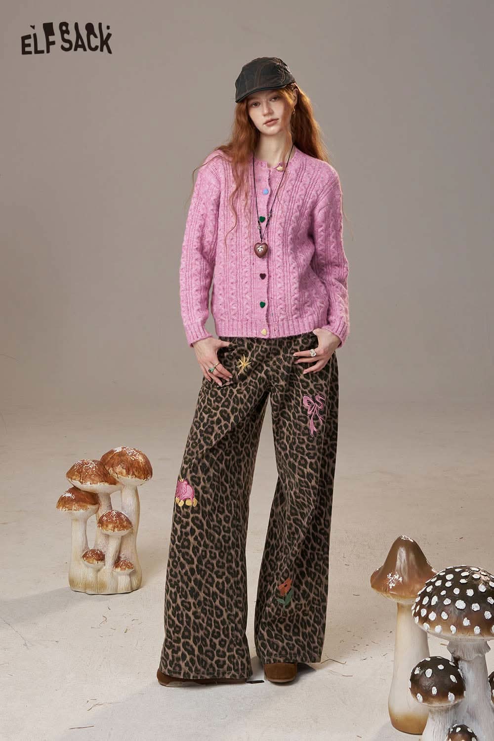 Pink ELFSACK soft knit cardigan for women paired with patterned wide-leg pants