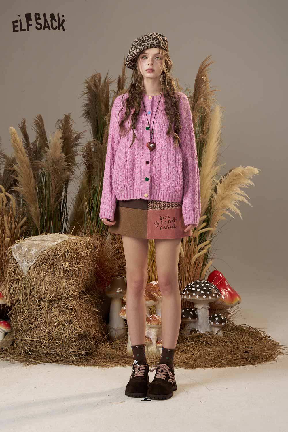 ELFSACK soft knit cardigan for women in pink, styled with a skirt and accessories for a trendy look