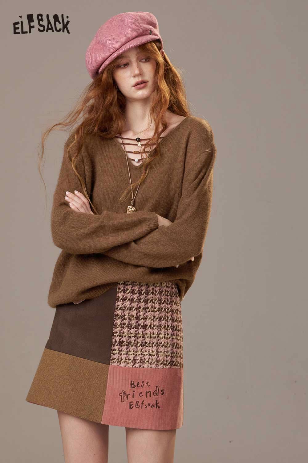 ELFSACK soft knit lace-up sweater in brown, styled with a patterned skirt for a chic look