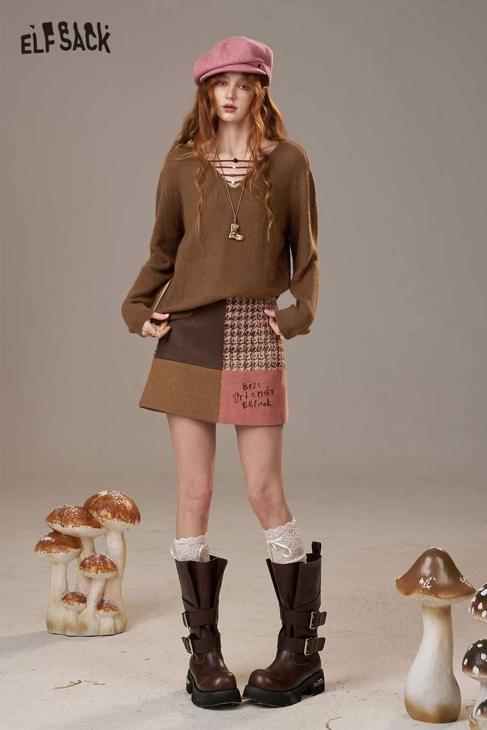 ELFSACK soft knit lace-up sweater in brown paired with a unique patchwork skirt and stylish boots