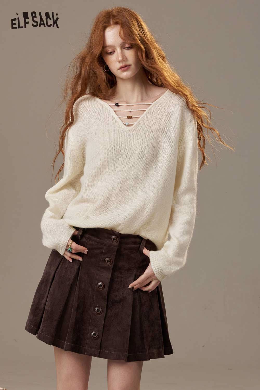 ELFSACK soft knit lace-up sweater in cream paired with a stylish brown skirt for a chic look