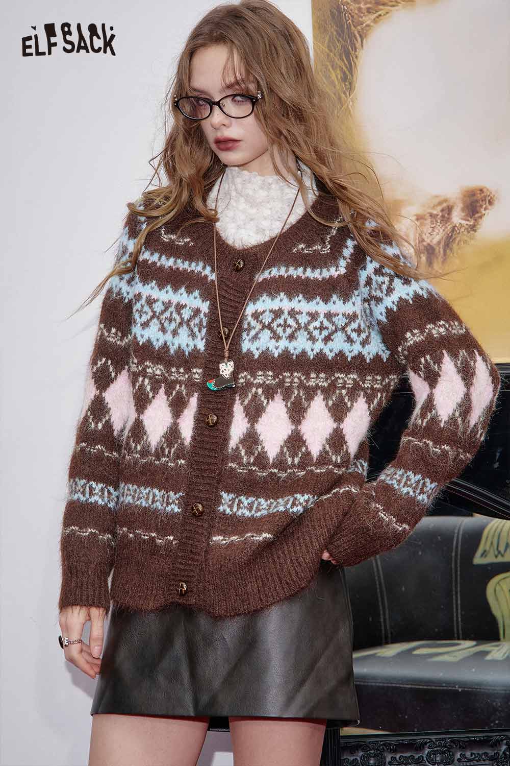 ELFSACK cozy brown sweater with geometric patterns styled over a leather skirt, perfect for pairing with soft plaid wide-leg pants