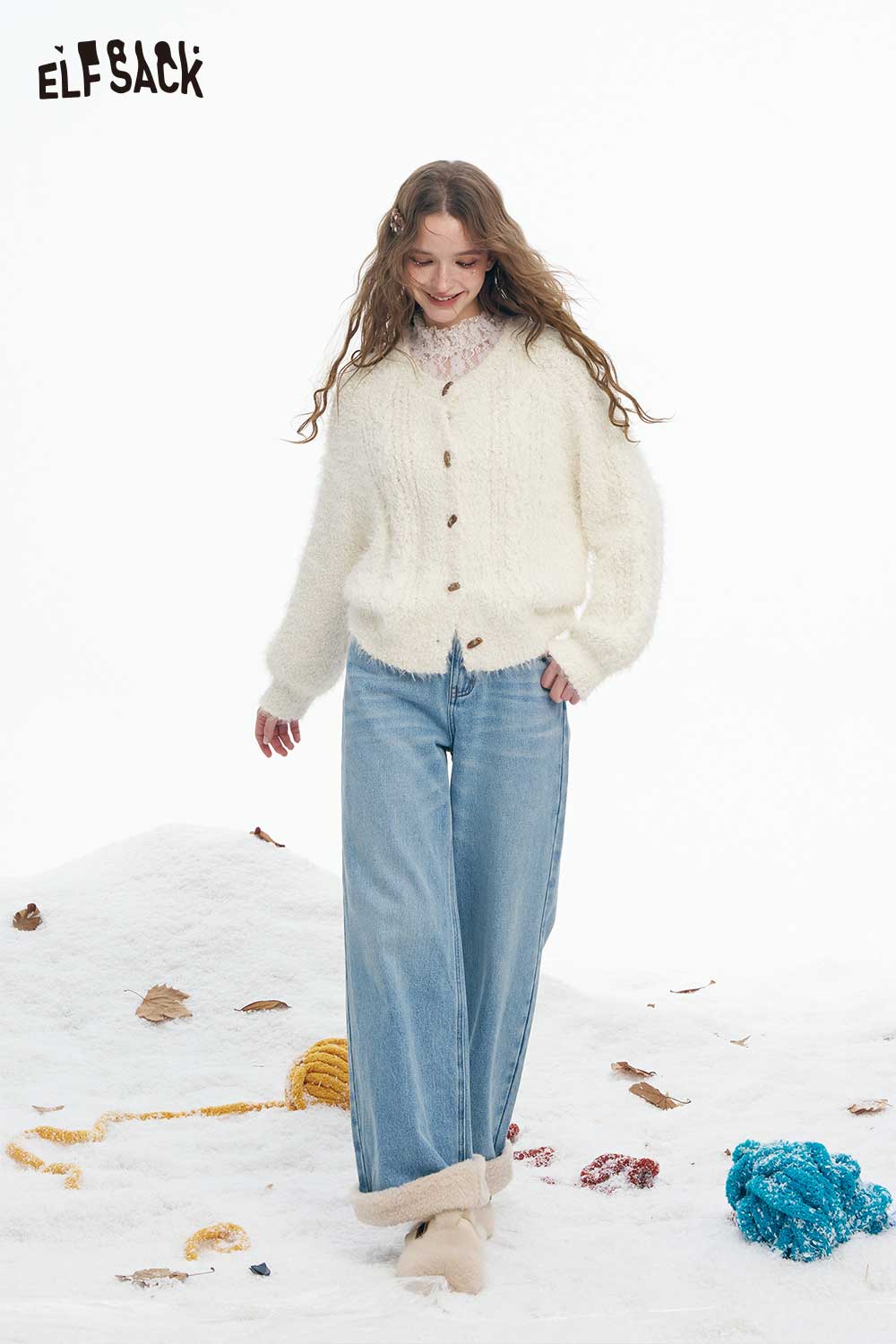 ELFSACK soft plush button sweater in cream worn by a model with wide-leg jeans