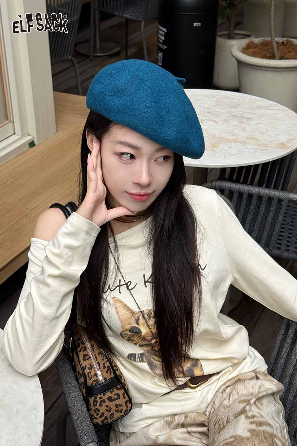 Stylish woman wearing a soft pumpkin beanie for women with a casual outfit and animal graphic tee