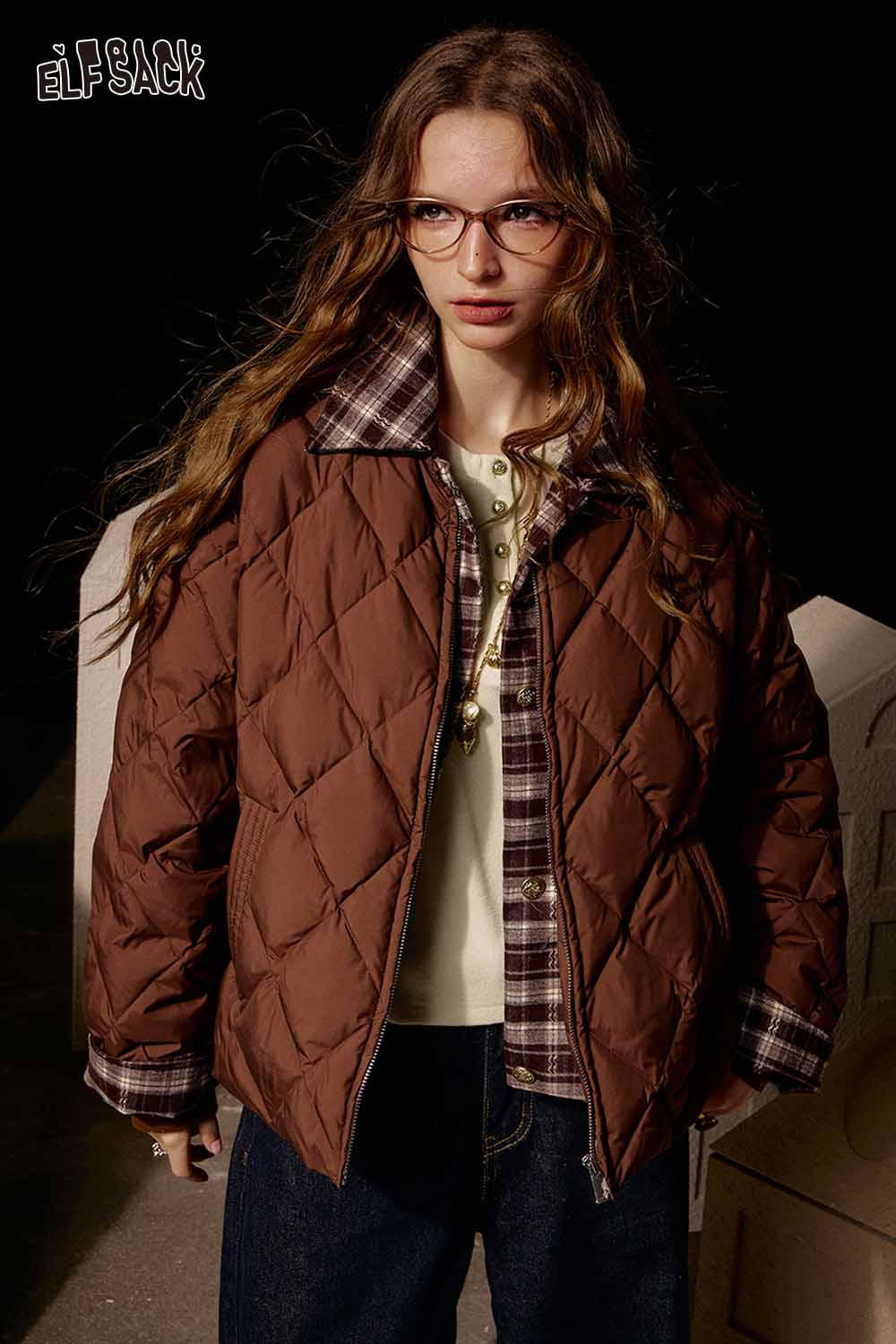 ELFSACK soft spliced sleeve long sleeve tshirt layered under a brown quilted jacket