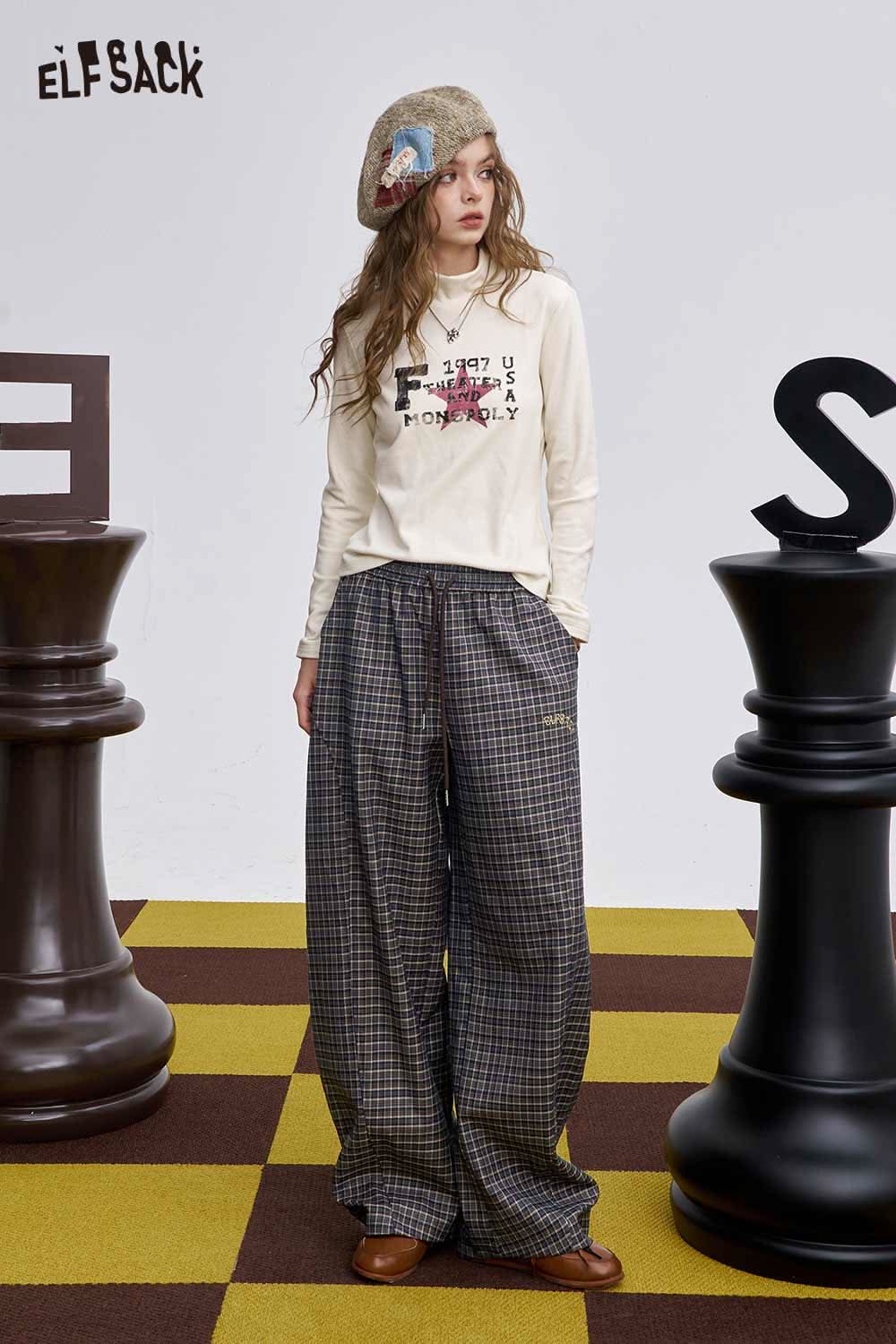 ELFSACK soft stripe embroidered wide leg pants styled with a graphic long sleeve shirt and beret