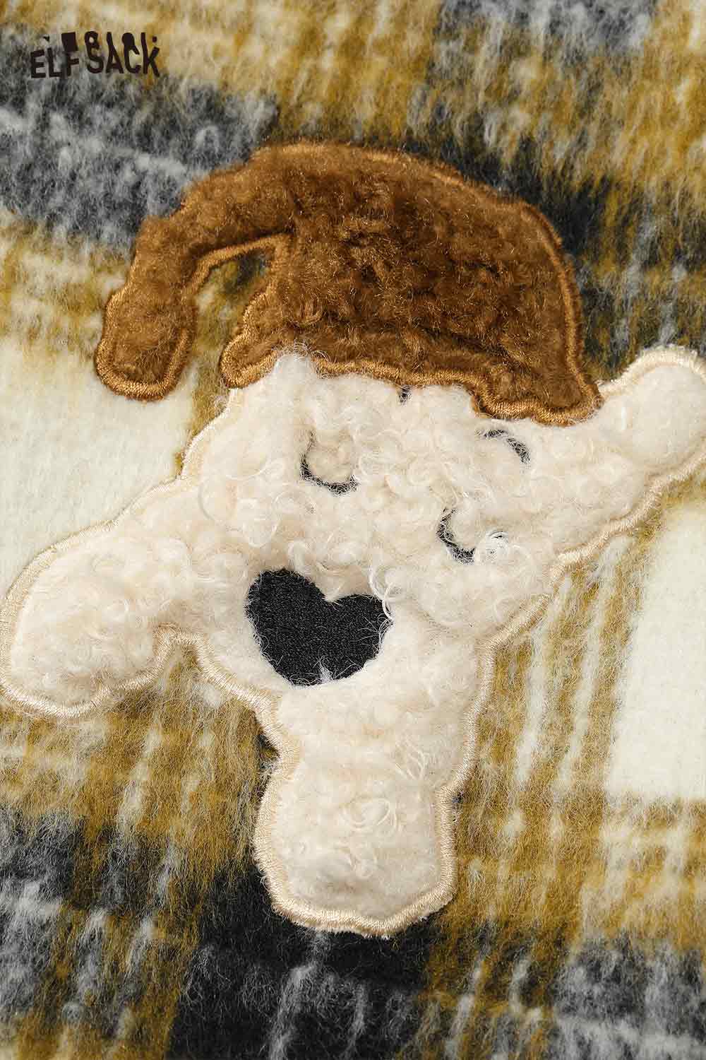 Close-up of ELFSACK soft striped long coat for women featuring playful embroidered character detail