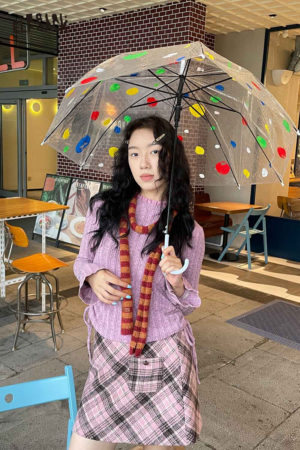 ELFSACK soft striped scarf for women styled with a pastel outfit and colorful umbrella