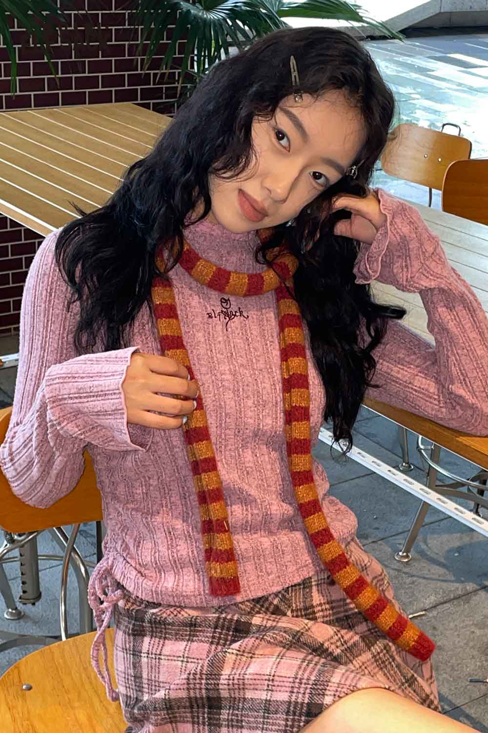 ELFSACK soft striped scarf for women styled with a pink ribbed sweater and plaid skirt