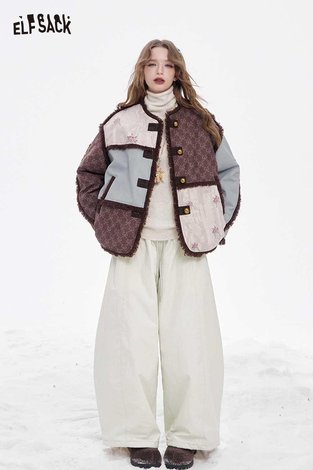 ELFSACK soft wide leg pants for women in a stylish outfit with a unique jacket on a snowy background