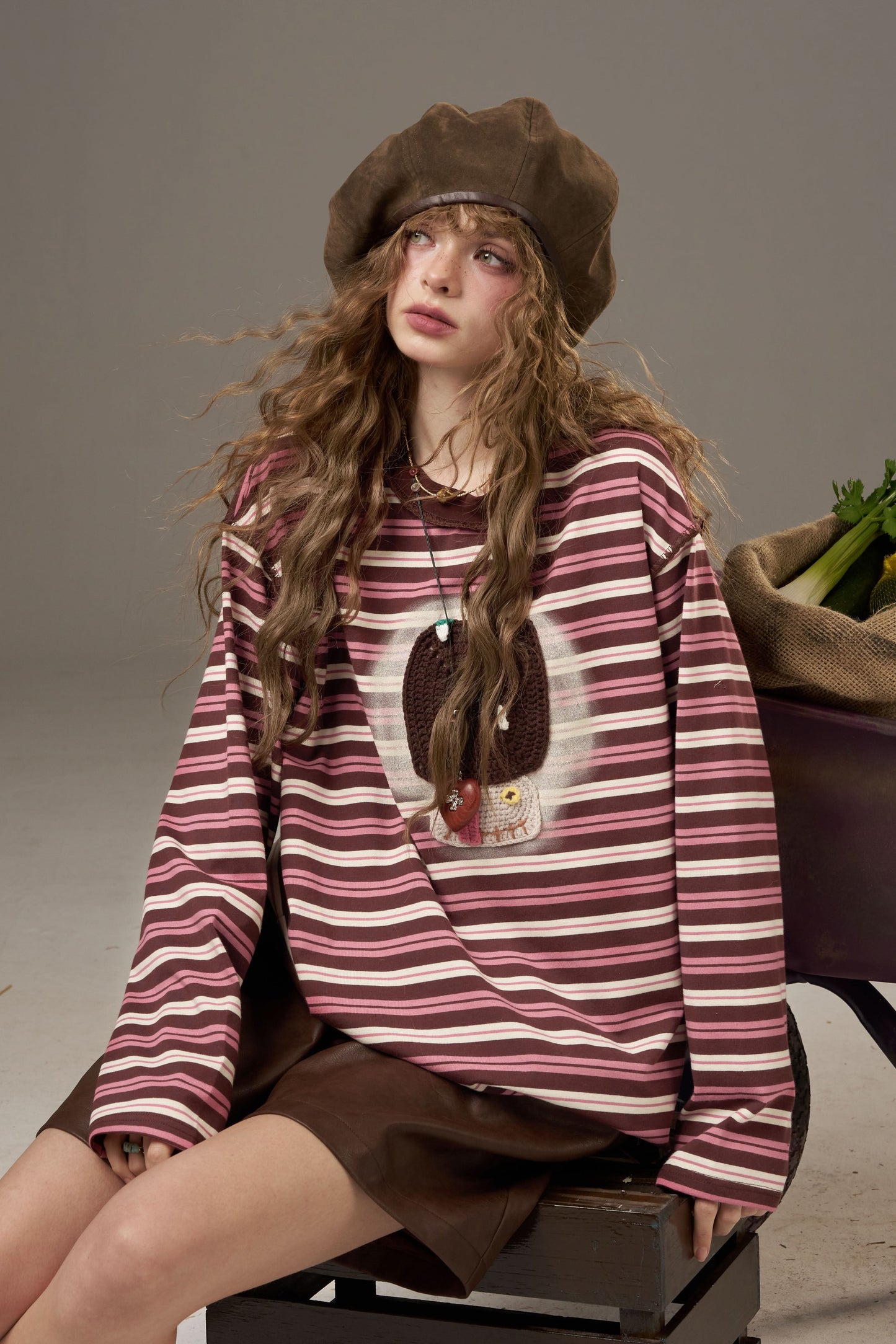 ELFSACK soft yarn sweatshirt for women featuring a striped design and playful graphic print