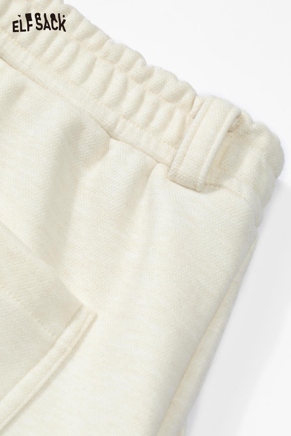 ELFSACK star graphic floor length pants in soft cream fabric with elastic waistband and side pockets