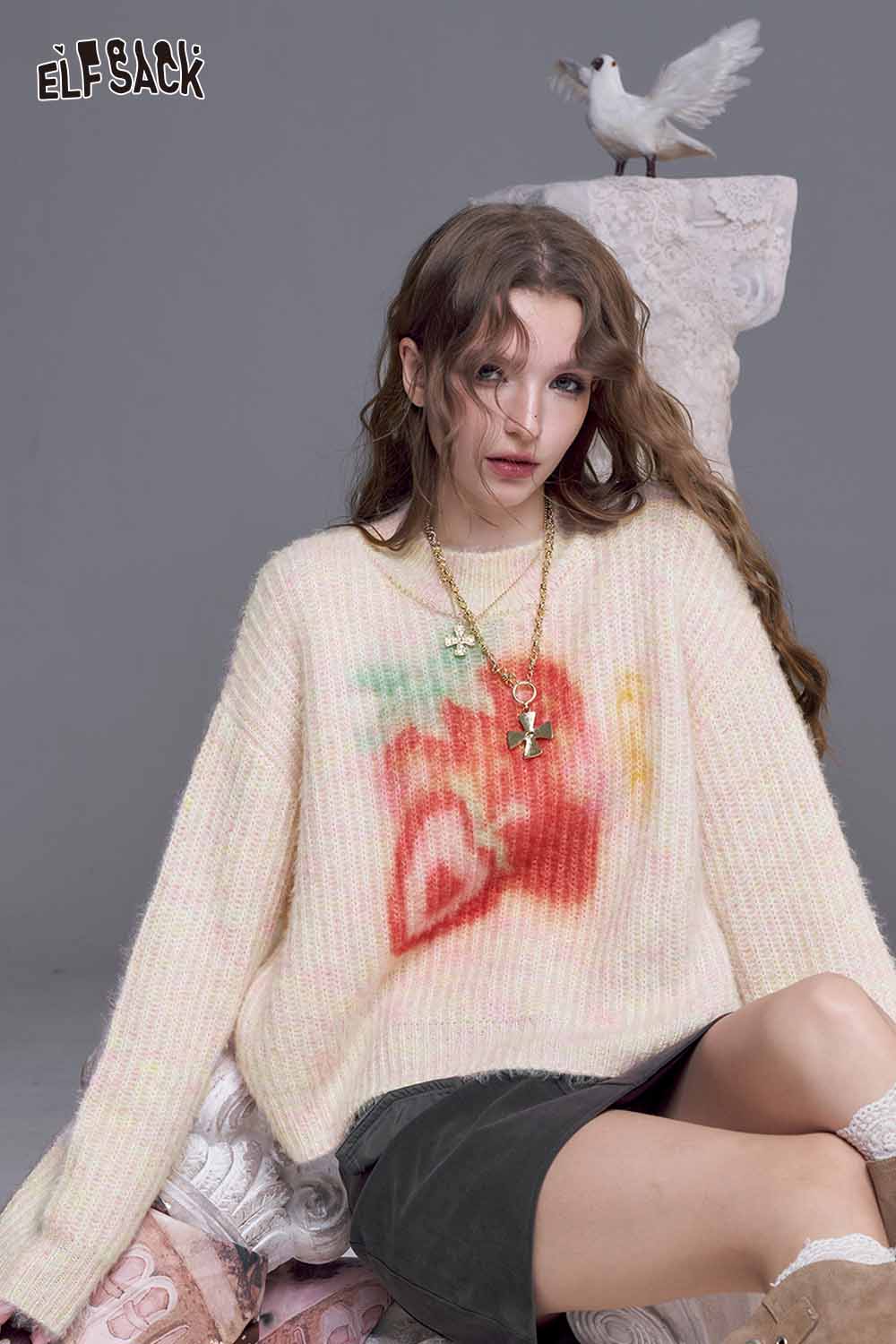 ELFSACK strawberry graphic knit sweater in soft pastel with a relaxed fit and vibrant strawberry design