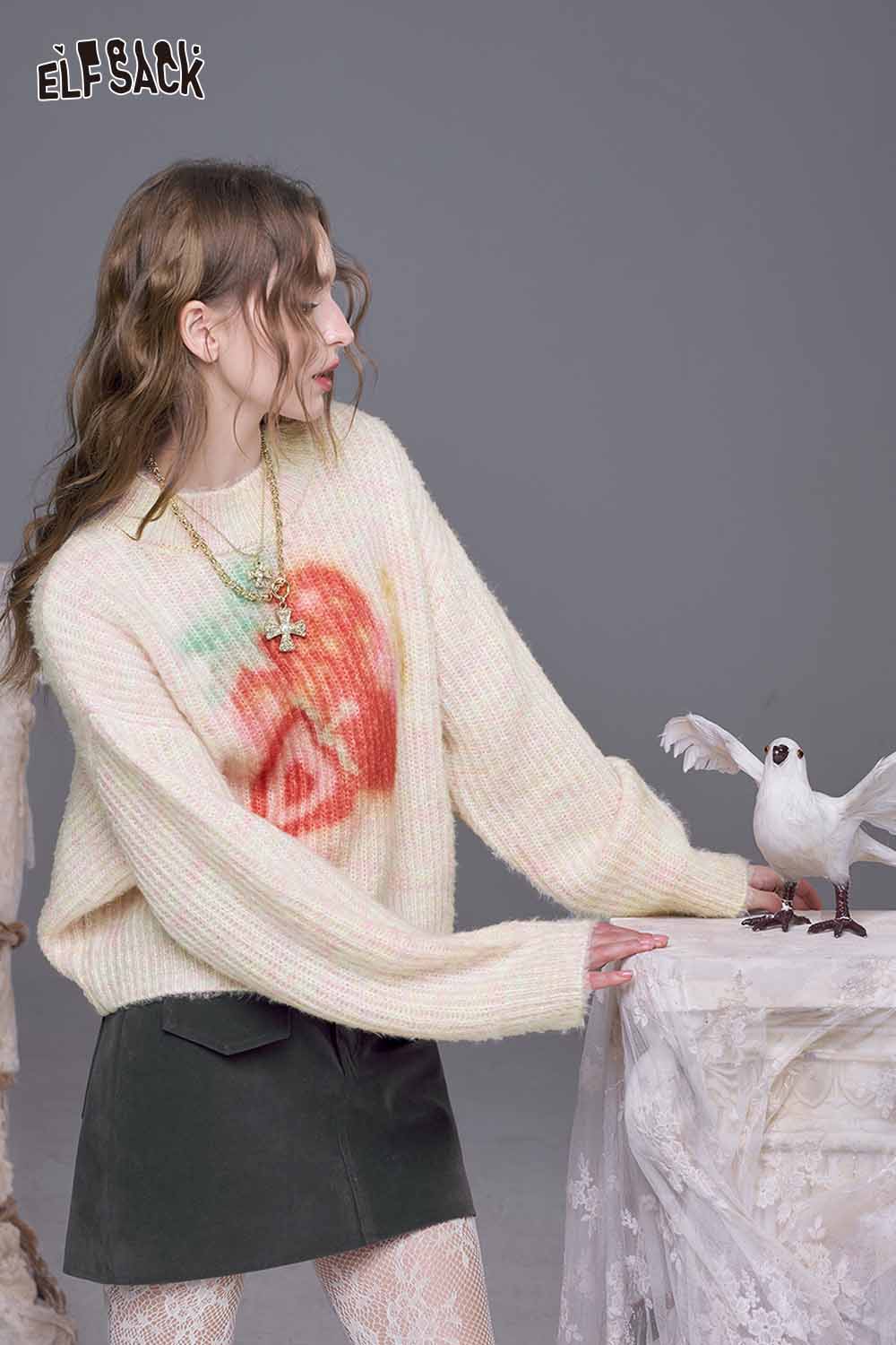 ELFSACK strawberry graphic knit sweater featuring a vibrant strawberry design in soft pastel colors