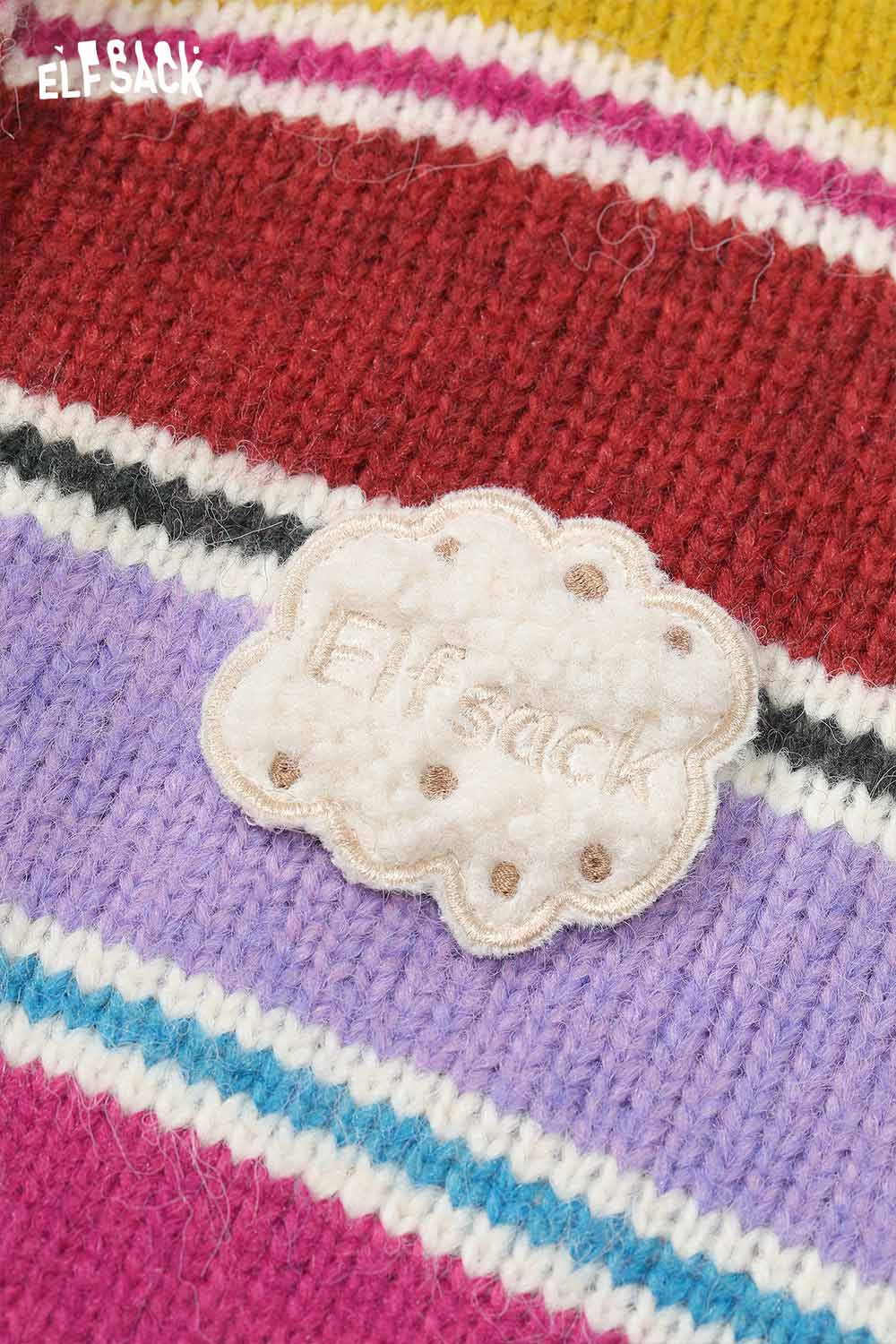 Close-up of ELFSACK stripe embroidery button sweater featuring colorful stripes and a unique logo patch