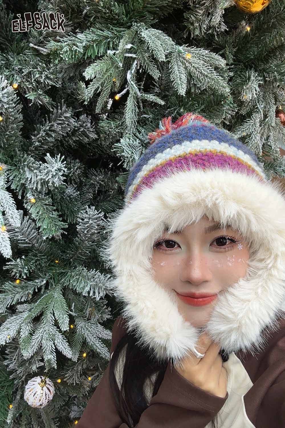 ELFSACK striped color block ear flap beanie in vibrant colors with faux fur trim against a snowy background