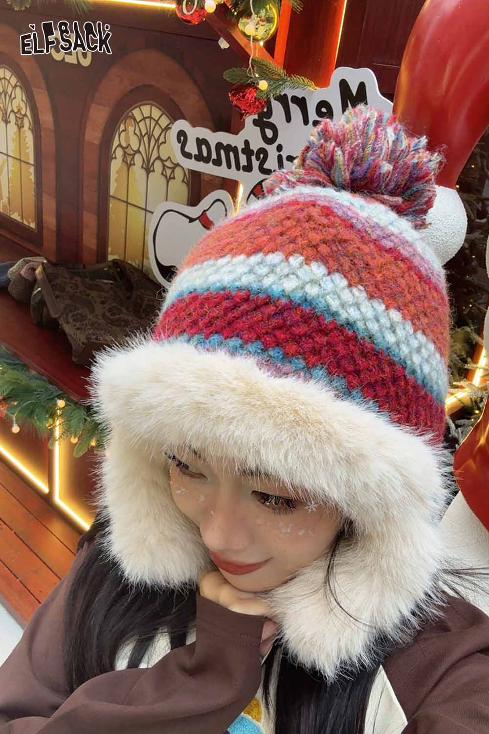 ELFSACK striped color block ear flap beanie with fuzzy lining and pom pom for a cozy winter look