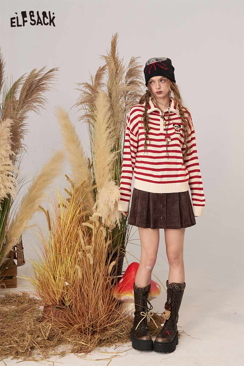 Striped panda graphic sweater women by ELFSACK styled with a brown skirt and boots in a natural setting