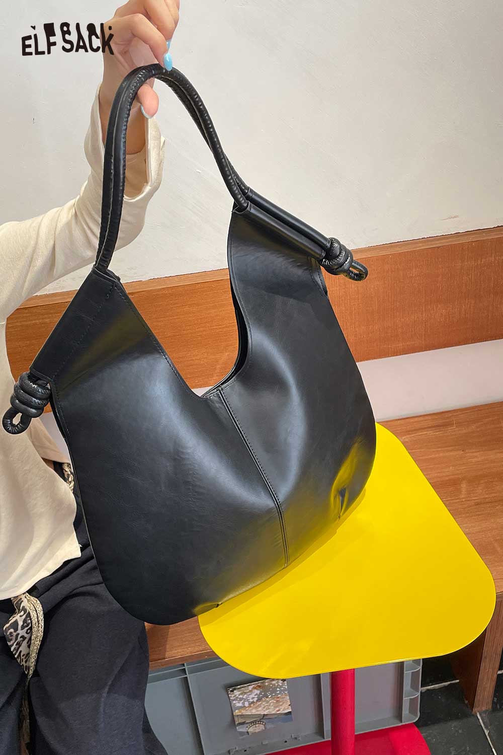 Stylish structured PU tote bag for women in black with unique knot handle design