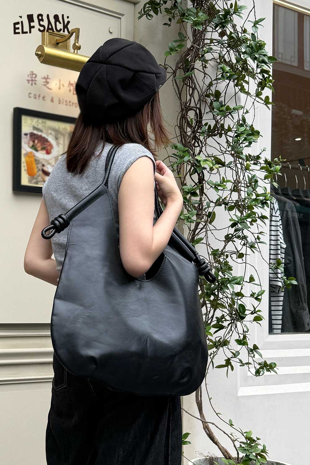 ELFSACK structured PU tote bag for women, worn casually with a stylish outfit outdoors