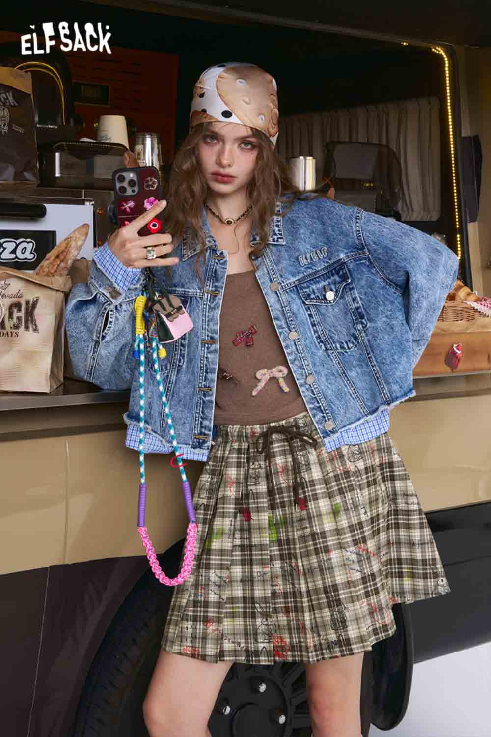 ELFSACK model wearing college style plaid mini skirt with denim jacket bandana and layered casual accessories