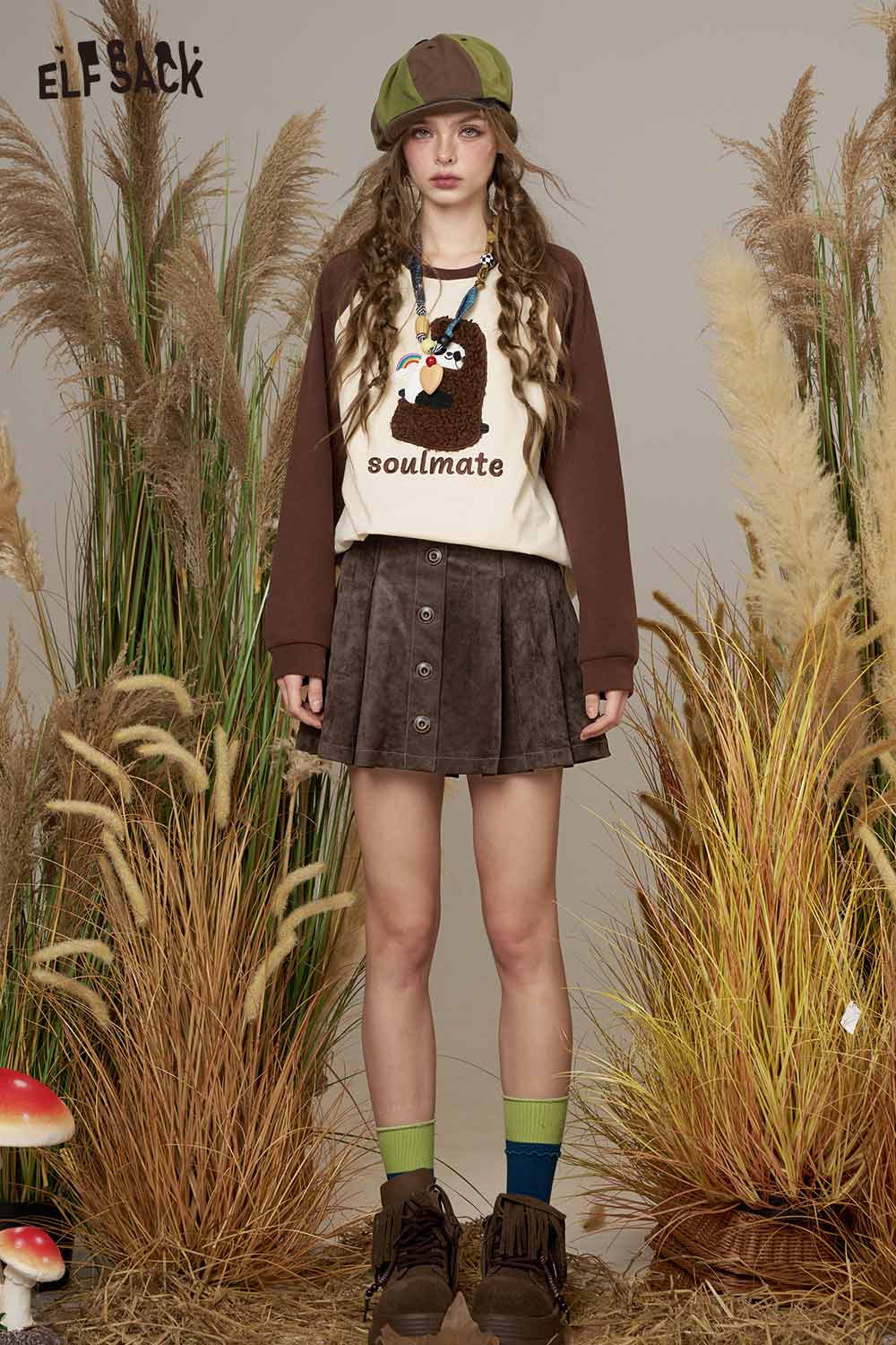 ELFSACK suede A-line mini skirt styled with a playful graphic top and earthy accessories