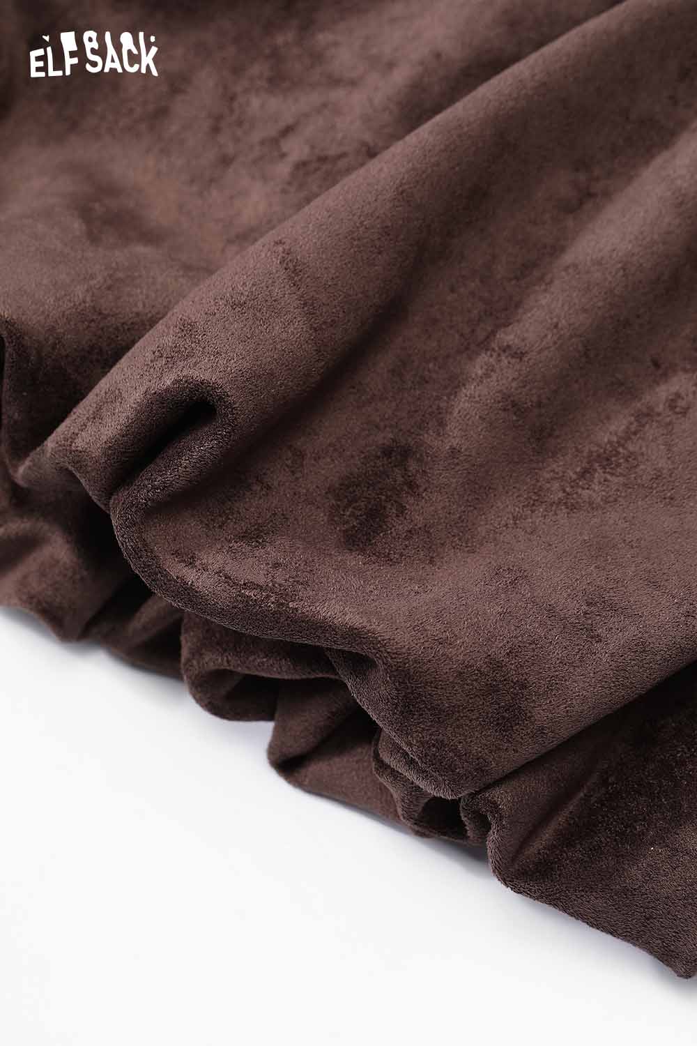 Close-up of ELFSACK suede bloomer mini skirt in rich brown fabric with soft texture