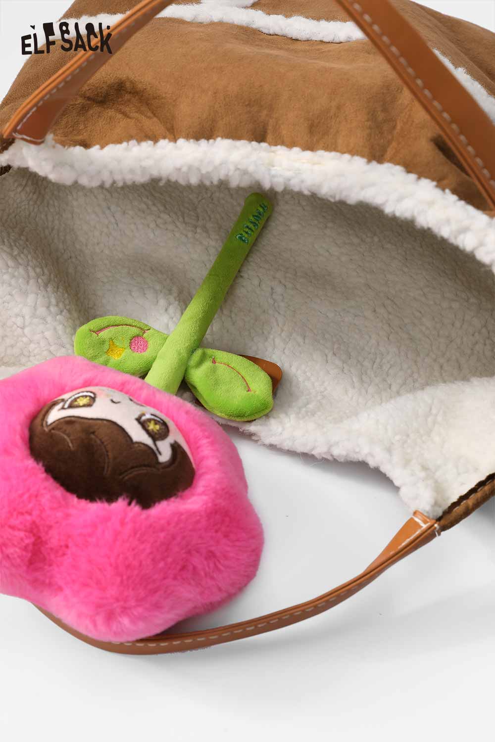 ELFSACK suede lambswool crossbody bag featuring a soft interior and a cute plush toy inside