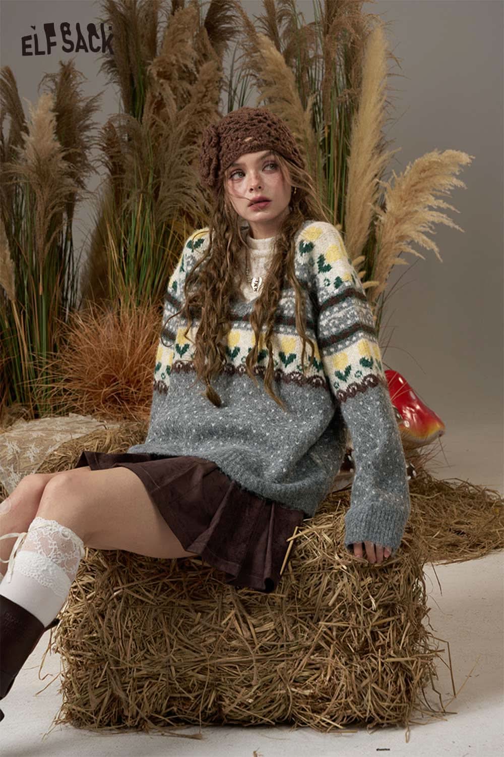 ELFSACK polka dot floral knit sweater in gray with colorful patterns, styled with a brown skirt