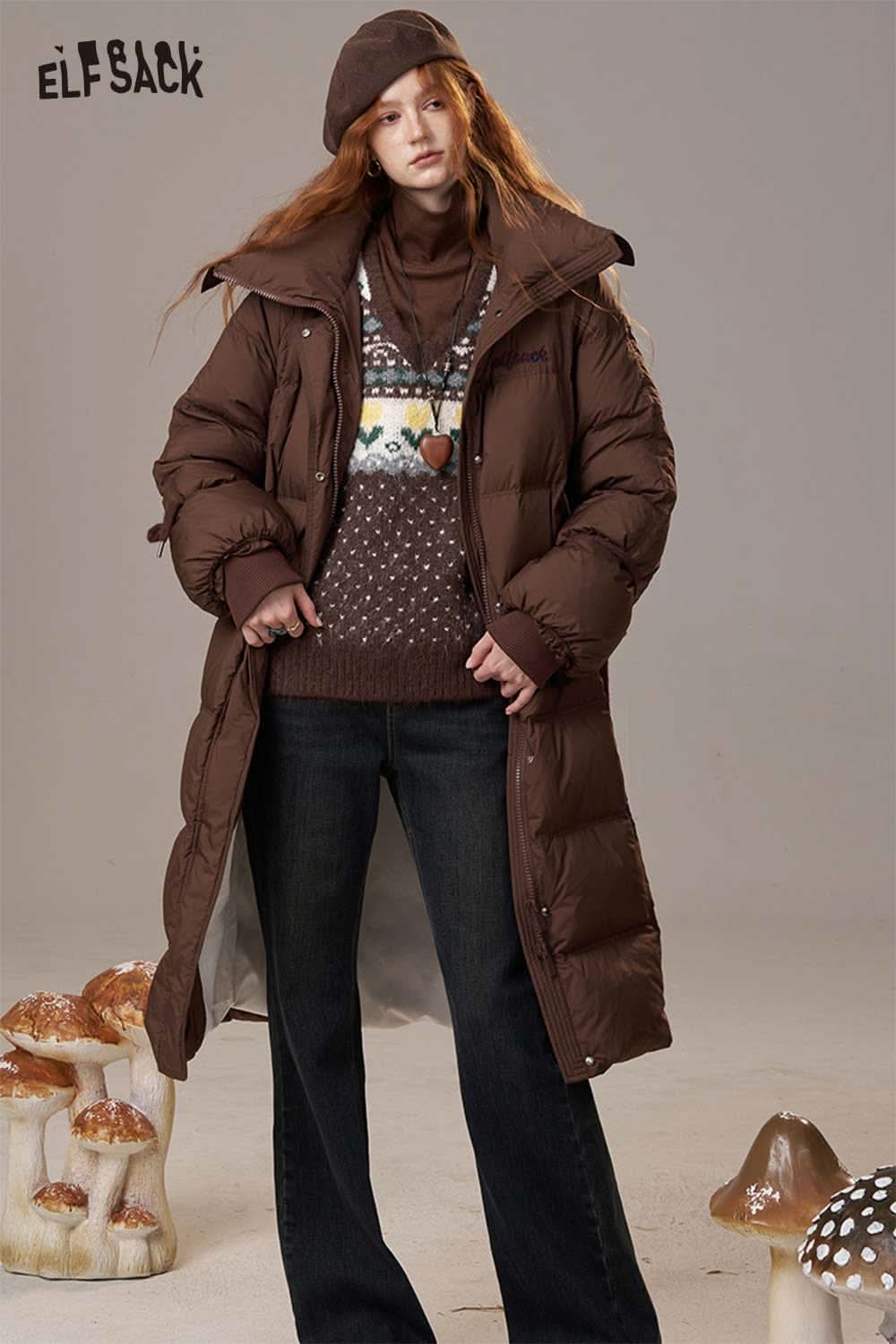 Fashion model wearing a polka dot floral knit sweater under a brown puffer coat for a stylish look