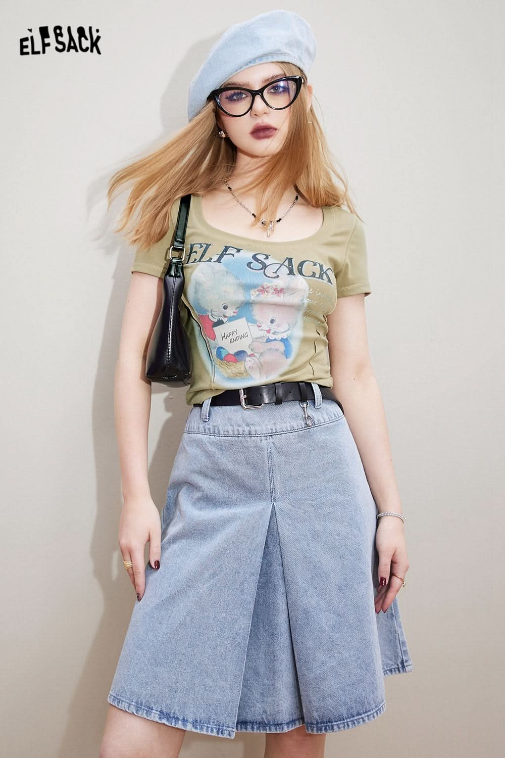 ELFSACK Sweet & Spicy graphic T-shirt in light olive worn with denim skirt and beret
