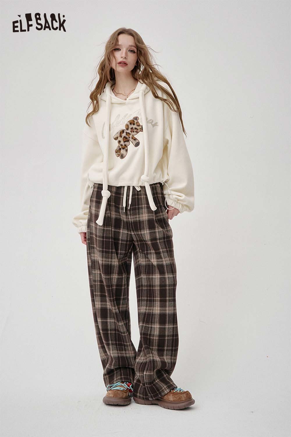 ELFSACK teddy bear applique hoodie in cream with cozy fit paired with plaid pants for a stylish look