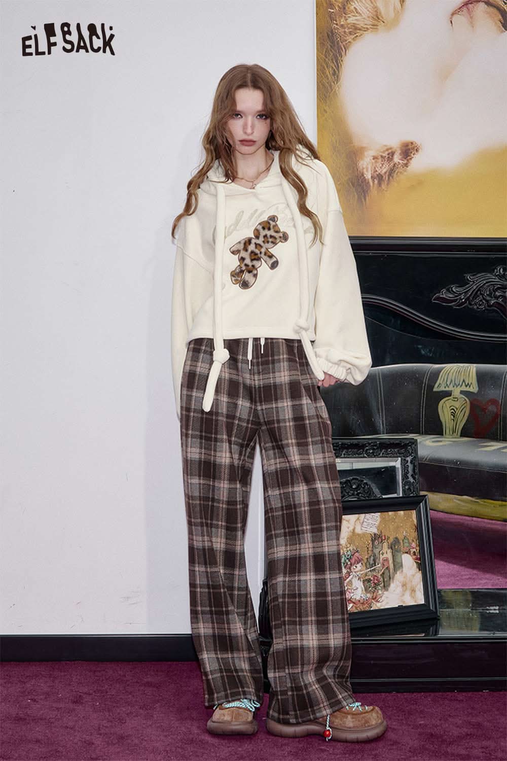 ELFSACK teddy bear applique hoodie in cream paired with plaid pants for a trendy look