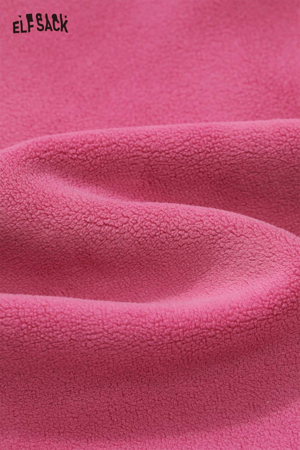 Soft pink fabric of the ELFSACK teddy bear applique hoodie with a cozy texture