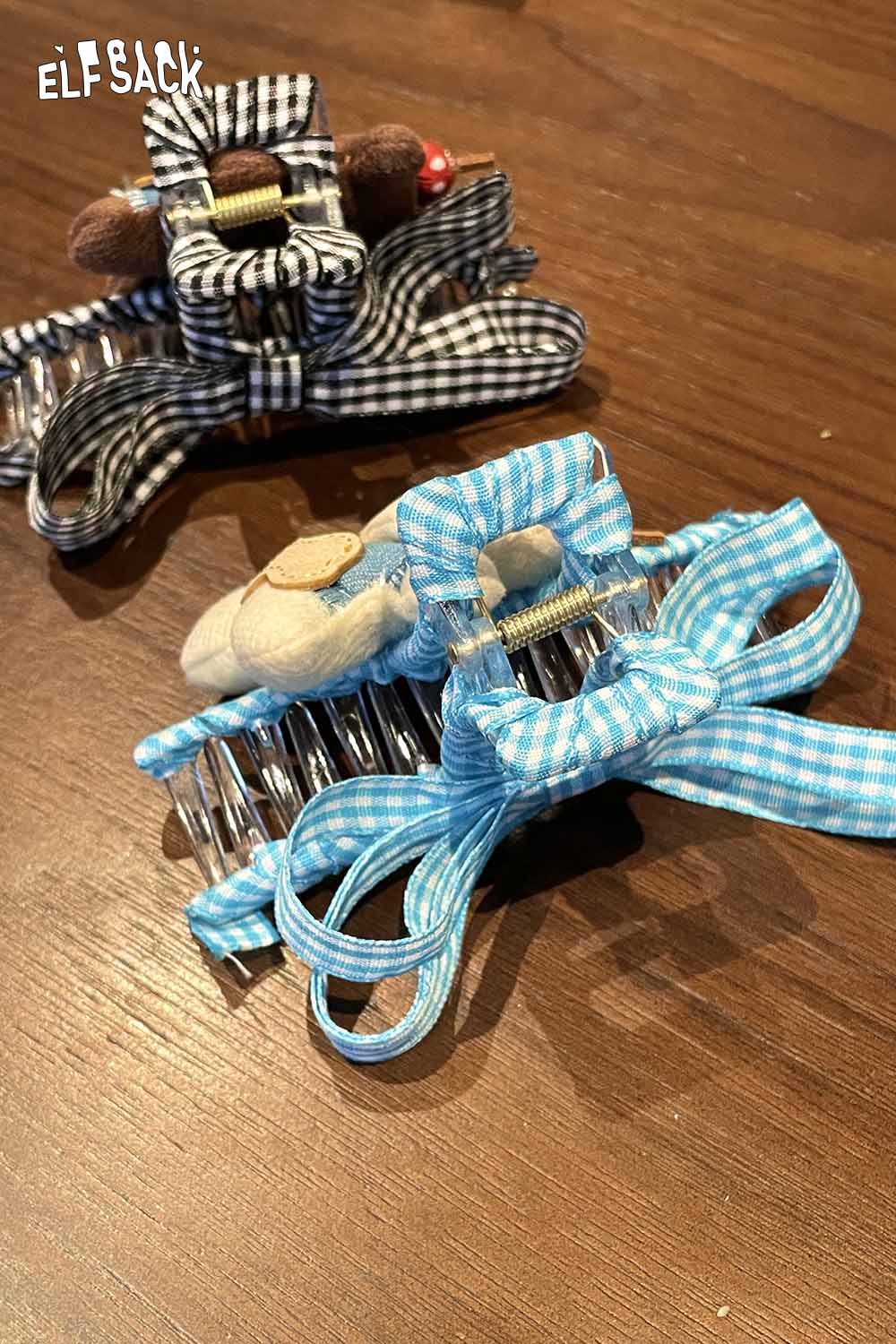 ELFSACK teddy bear hair clip featuring a cute design with ribbons and a playful teddy bear accent