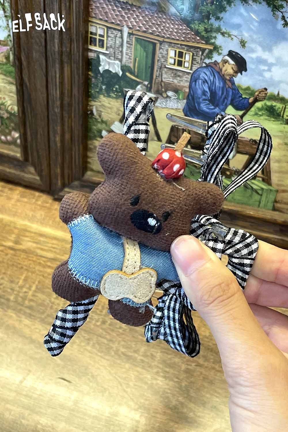ELFSACK Teddy bear hair clip with plaid ribbons and cute bear design, perfect for hair styling