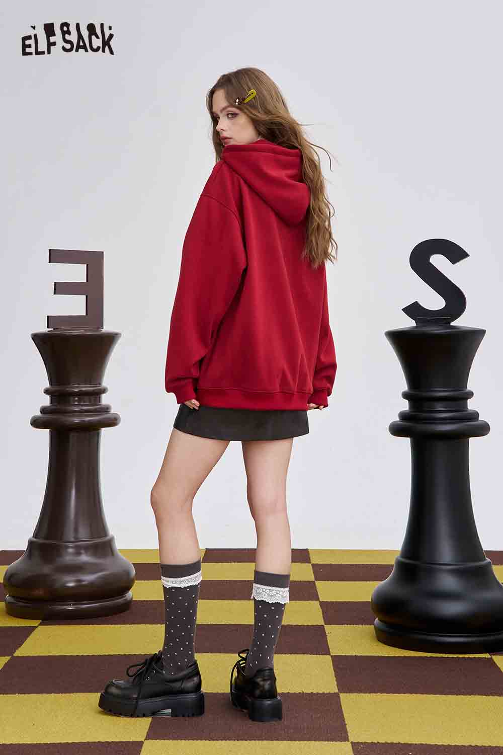 ELFSACK teddy bear hair clips showcased with a model wearing a red hoodie and stylish outfit