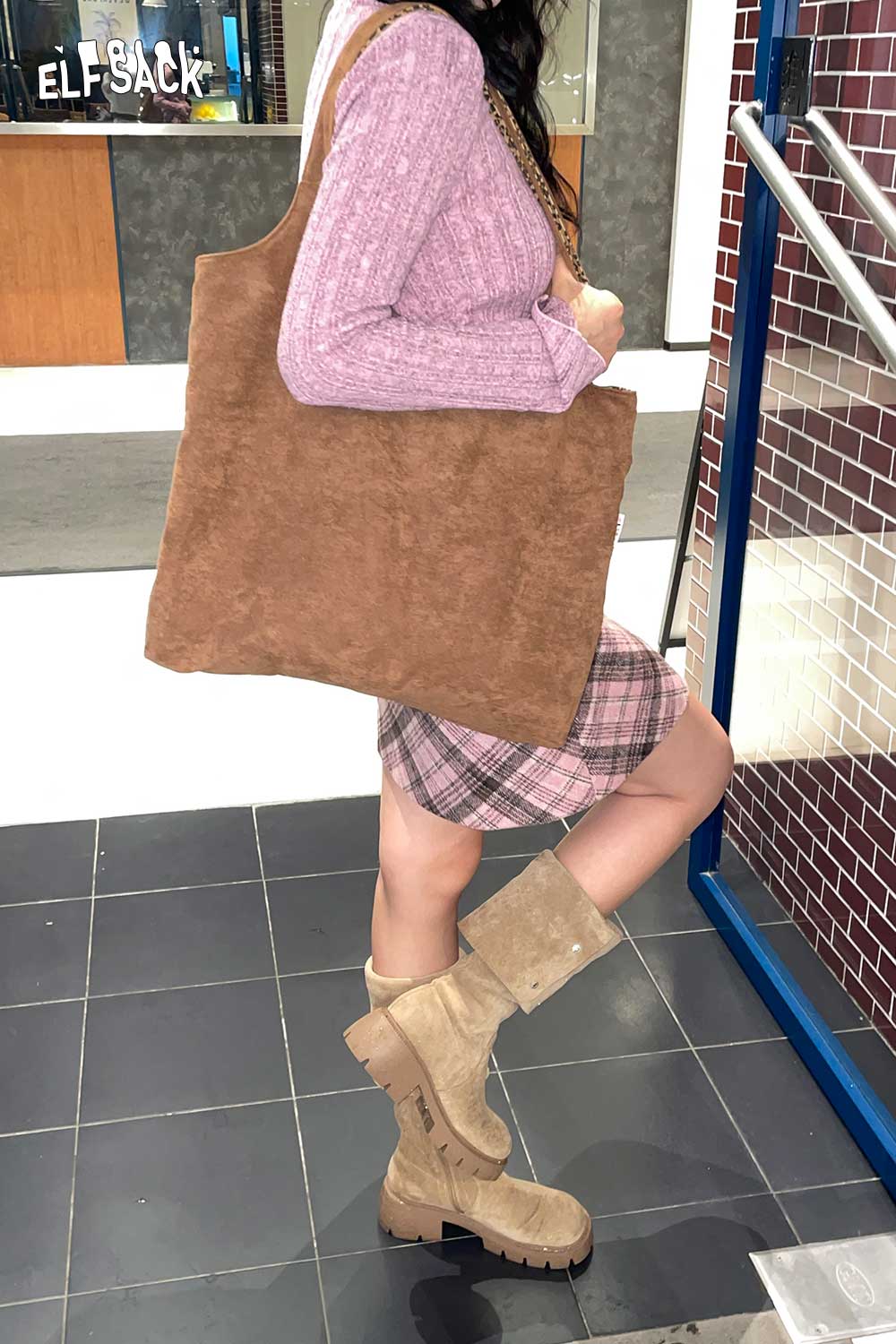 Textured oversized hobo bag in a stylish outfit, perfect for casual or chic looks