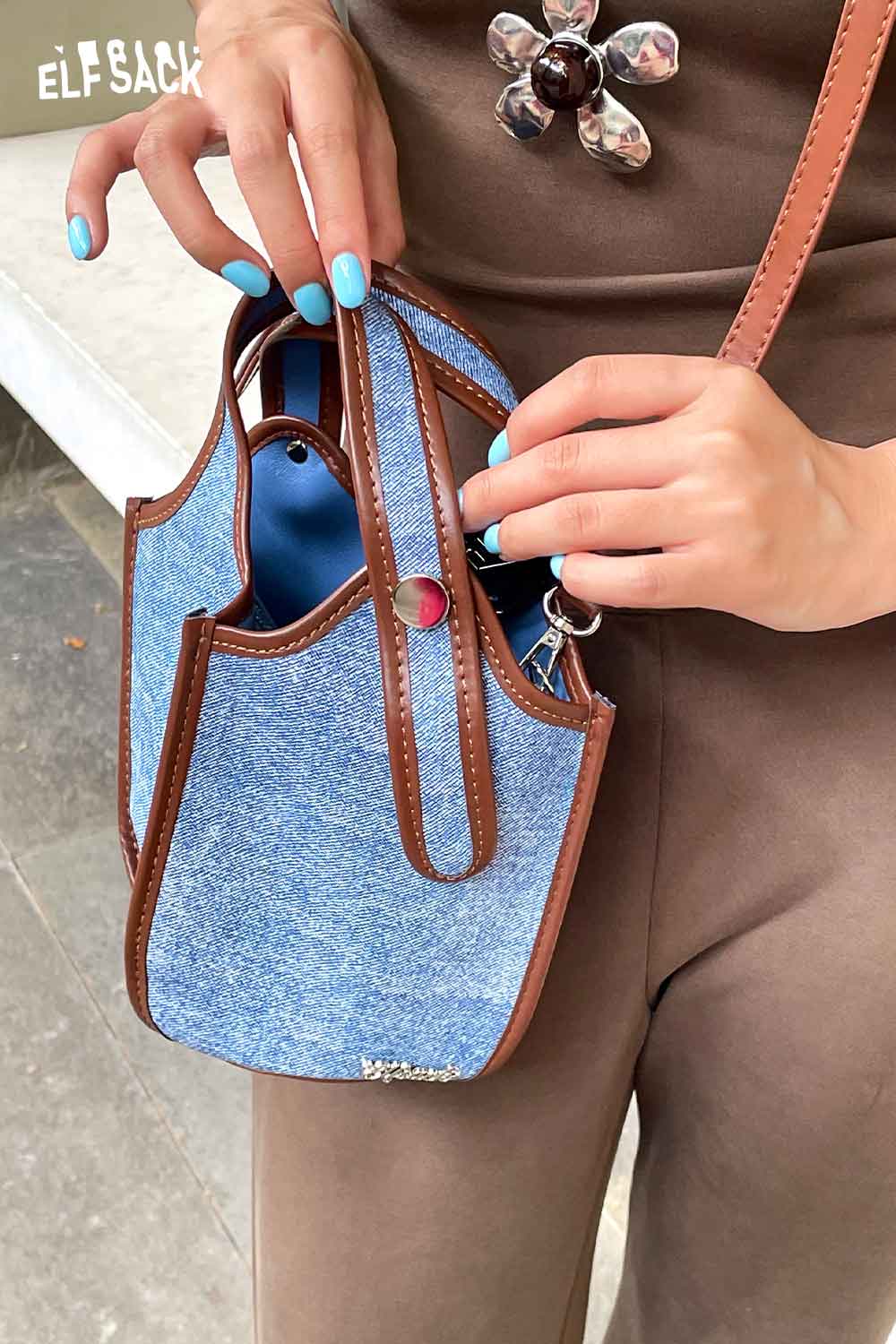 ELFSACK upcycled denim crossbody bag with stylish brown accents and durable design