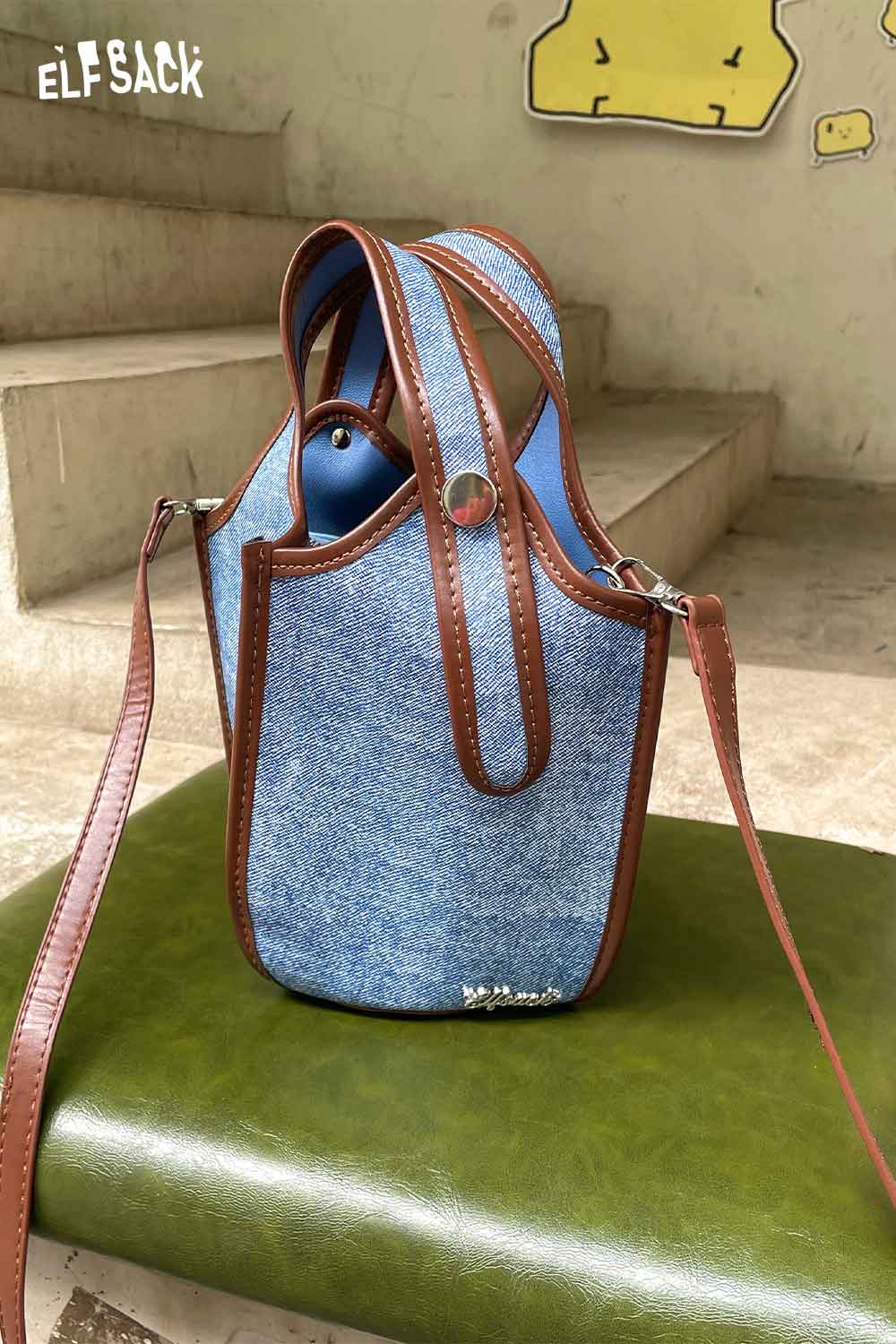 ELFSACK upcycled denim crossbody bag with brown leather accents and adjustable strap for stylish carrying