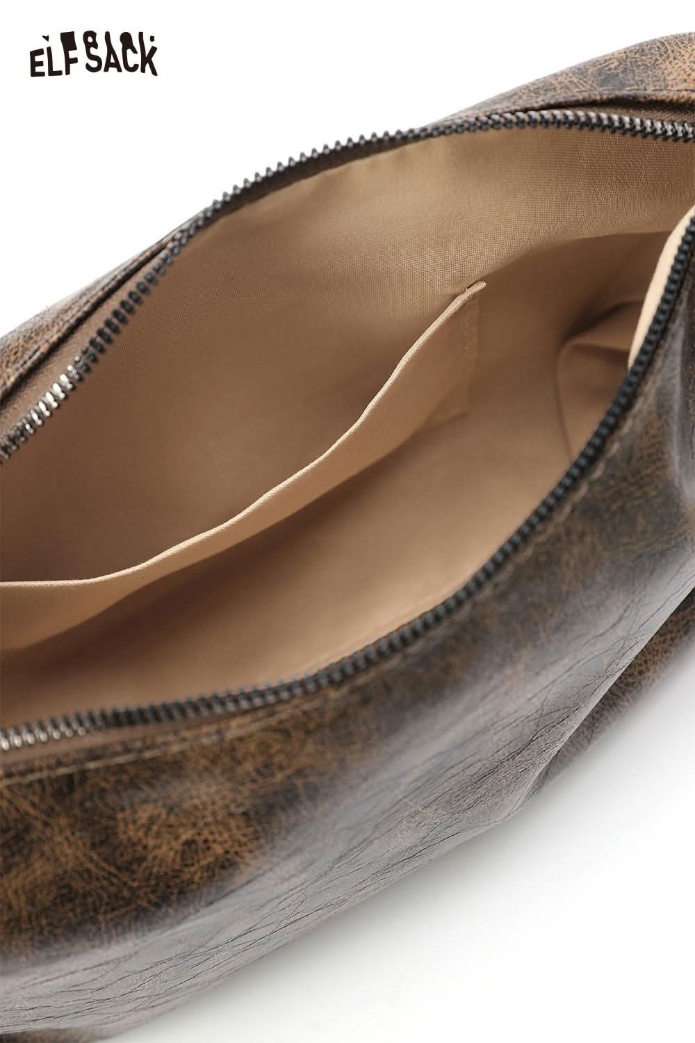 Interior view of vegan leather 90s shoulder bag with spacious compartment and zipper closure