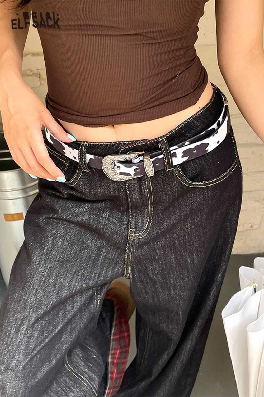 ELFSACK vegan leather cowhide pattern belt styled with high-waisted black jeans