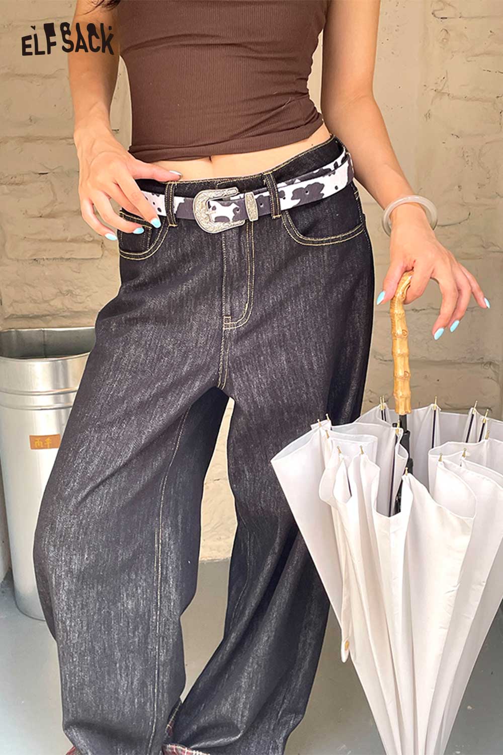 Stylish ELFSACK vegan leather cowhide pattern belt paired with high-waisted dark denim jeans