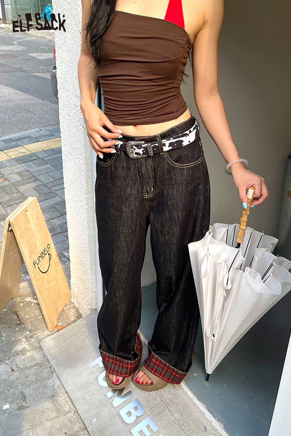 ELFSACK vegan leather cowhide pattern belt styled with wide-leg jeans and a tank top