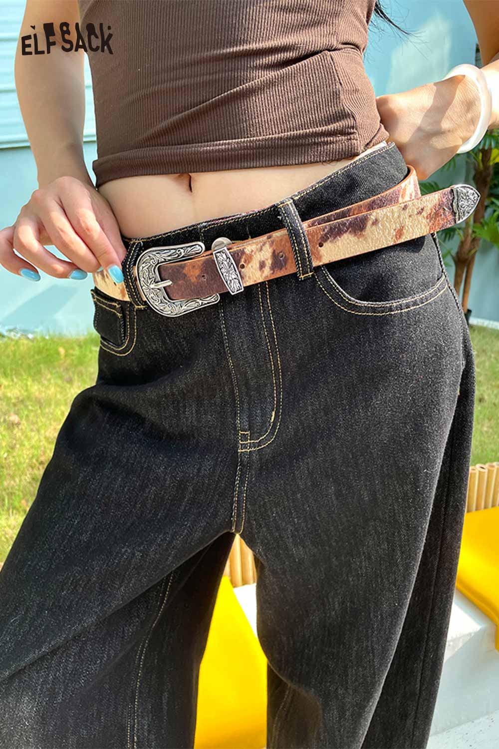 ELFSACK vegan leather cowhide pattern belt styled with high-waisted jeans for a trendy look