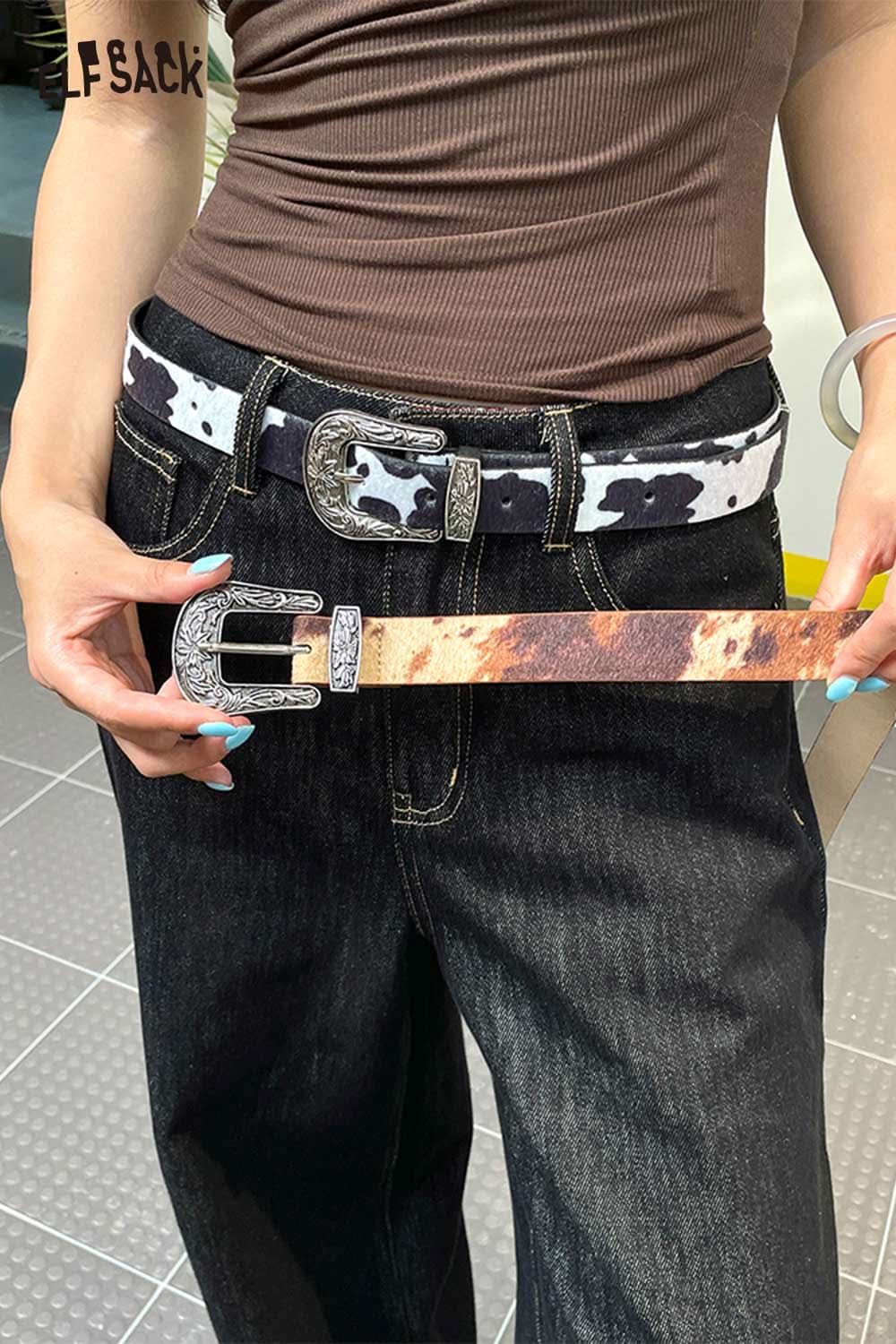 ELFSACK vegan leather cowhide pattern belt with silver buckle styled with high-waisted jeans
