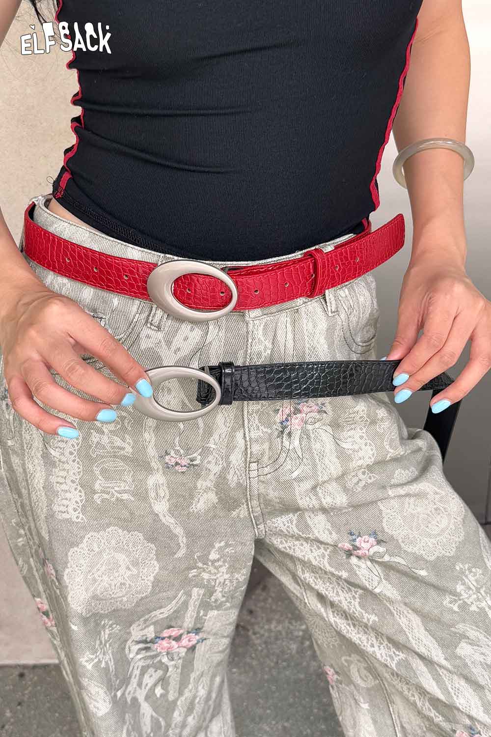 ELFSACK vegan leather croc-embossed belt in black style, worn with trendy relaxed pants
