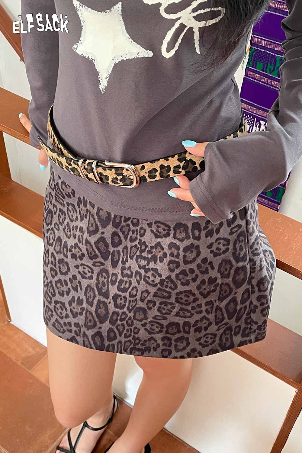 ELFSACK vegan suede animal print belt featured on a stylish outfit with a leopard print skirt