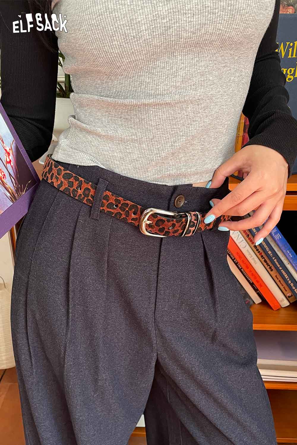 ELFSACK vegan suede animal print belt styled with high-waisted trousers for a trendy look