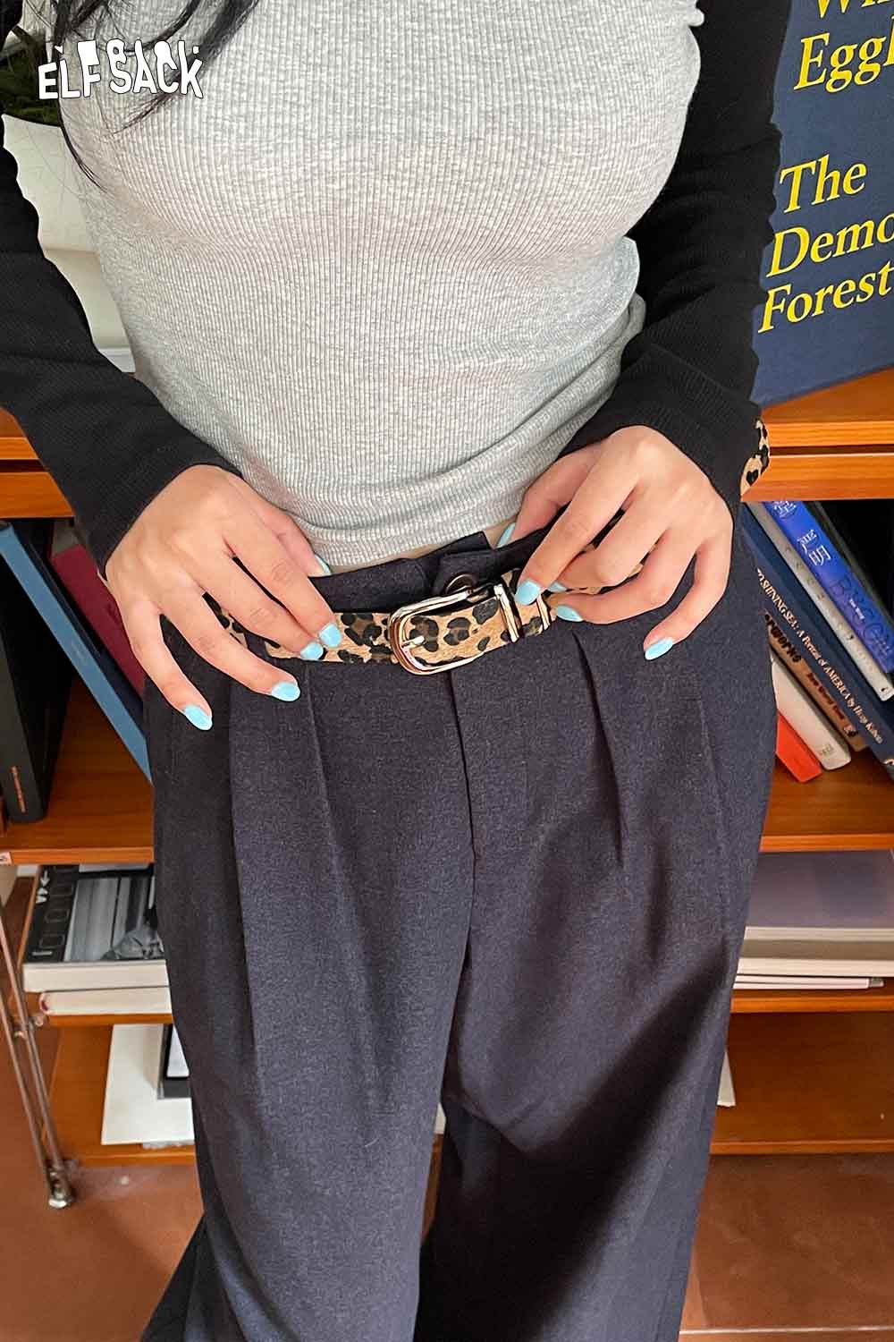 ELFSACK Vegan Suede Animal Print Belt styled with high-waisted trousers for a trendy look